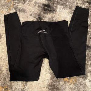 Lorna Jane black leggings with slits along outside of both legs